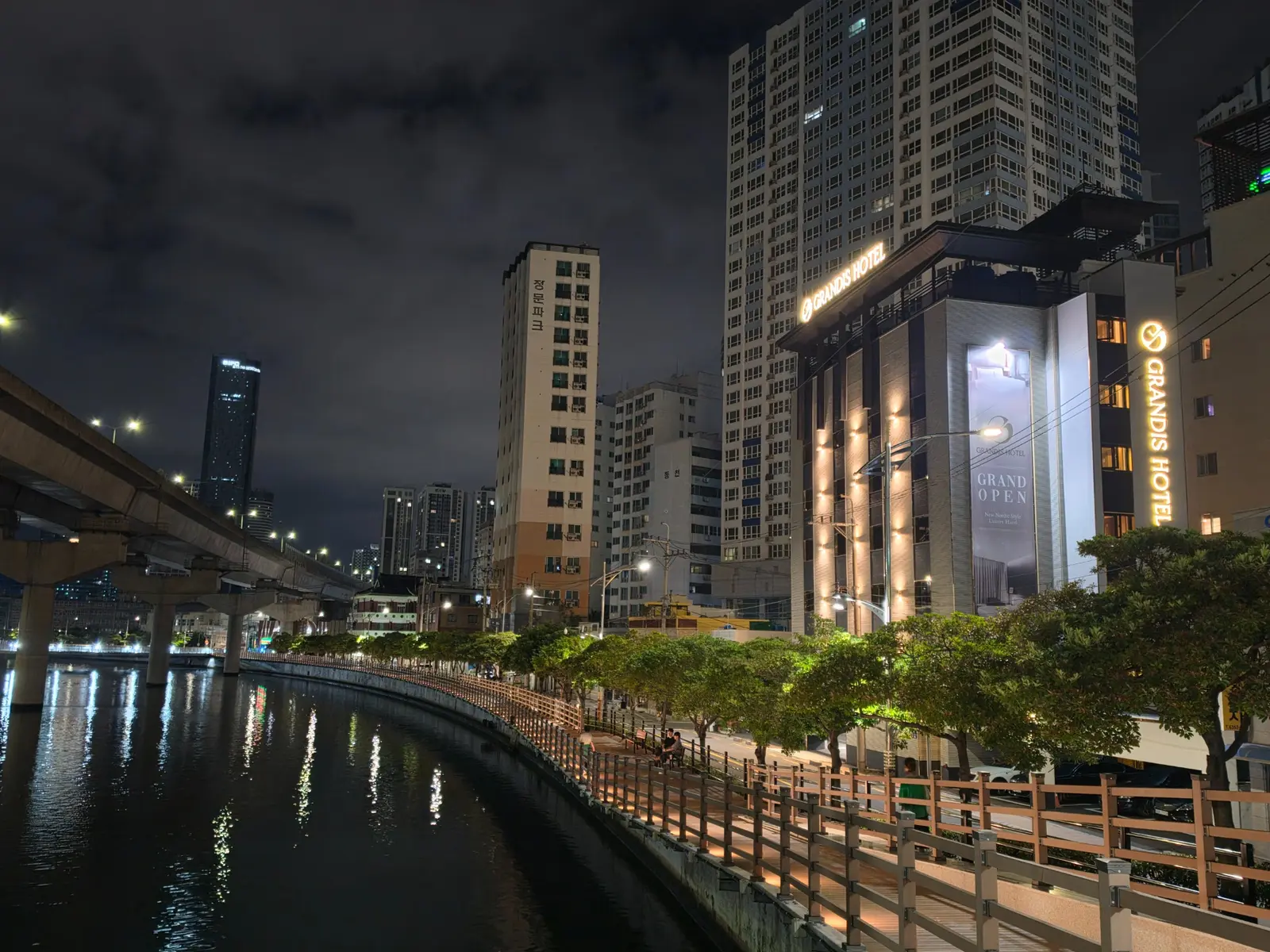 Grandis Hotel Munhyeon at night beside the stream and waterside deck